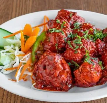 Spicy chicken bites served as a shareable side at Pizza Bank in Calgary SW